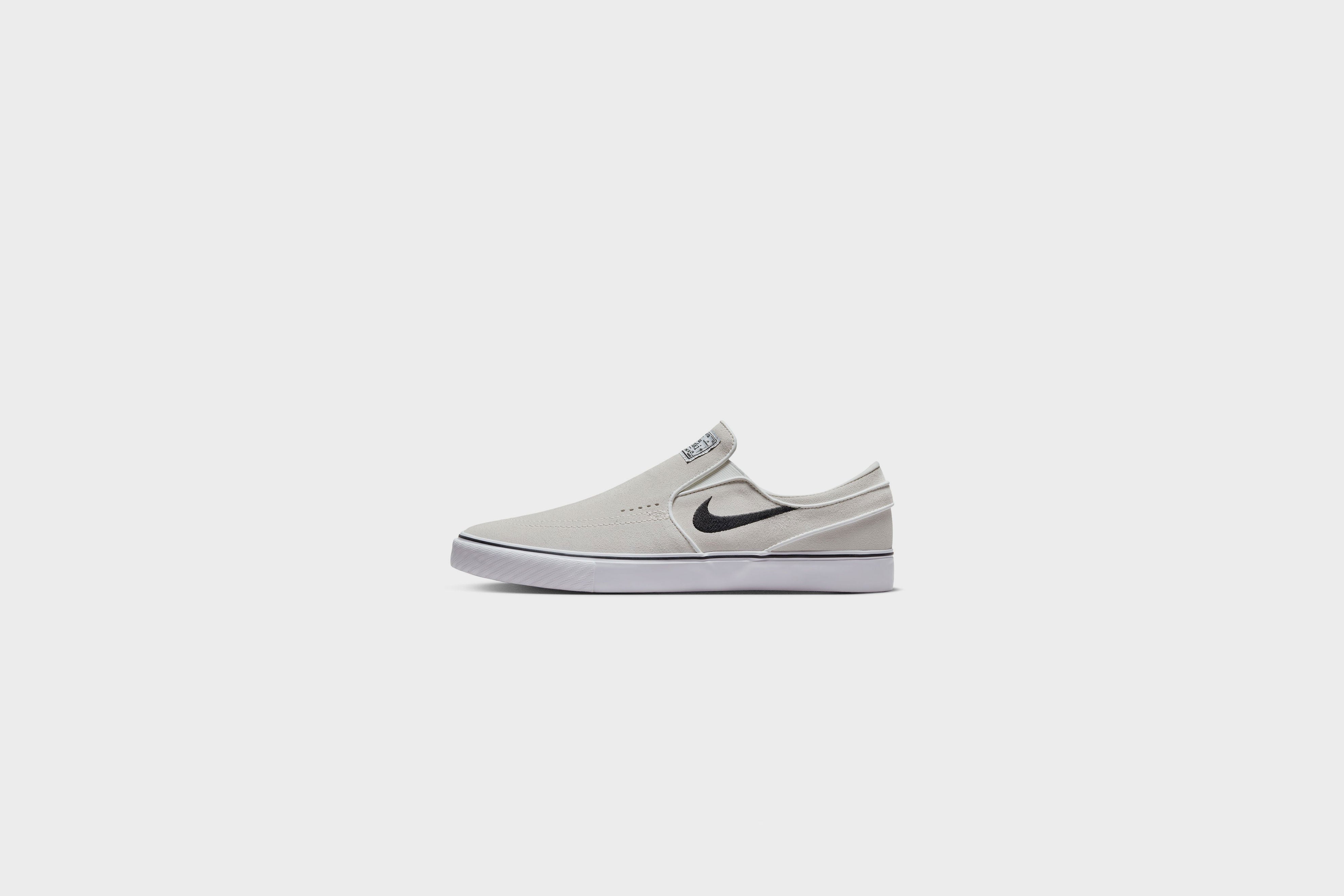 Nike sb janoski slip on all black best sale